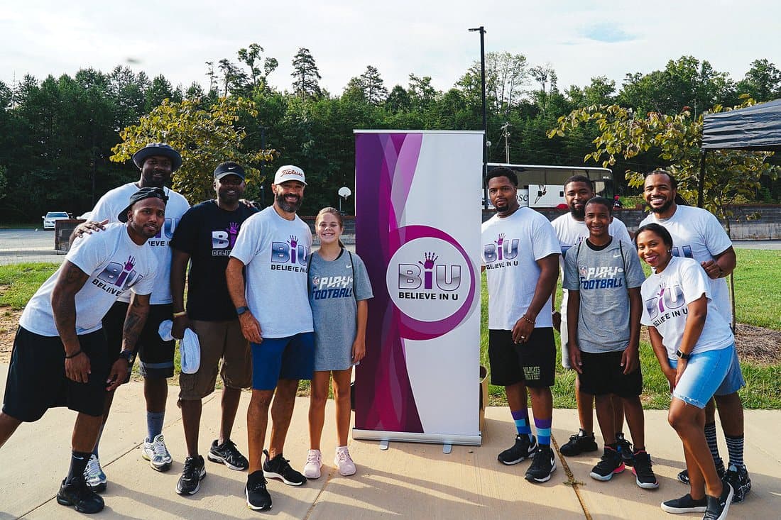 Campers and counselors posing together outdoors